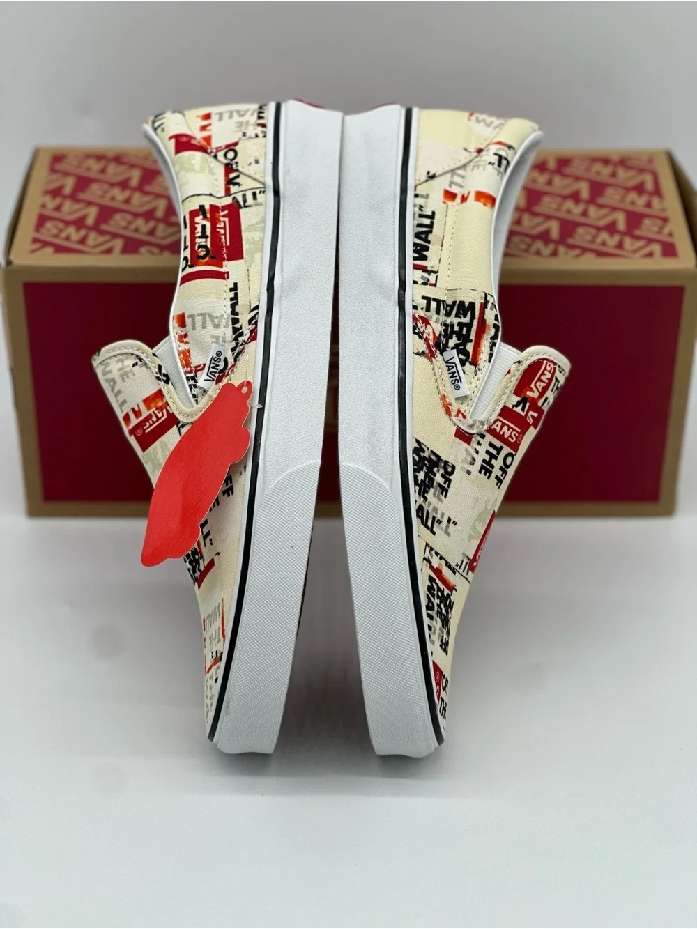 Vans Slip-On Sneakers in Cream, Red & Black Graphic Print